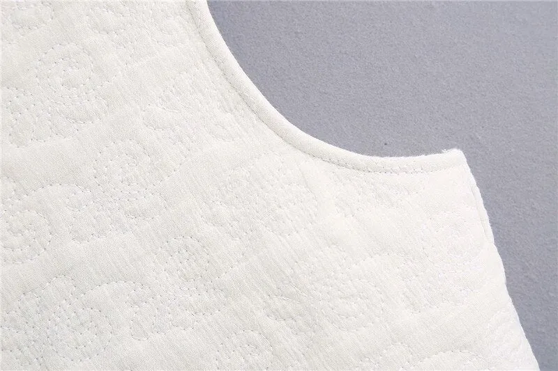 WAVY HEM QUILTED TOP